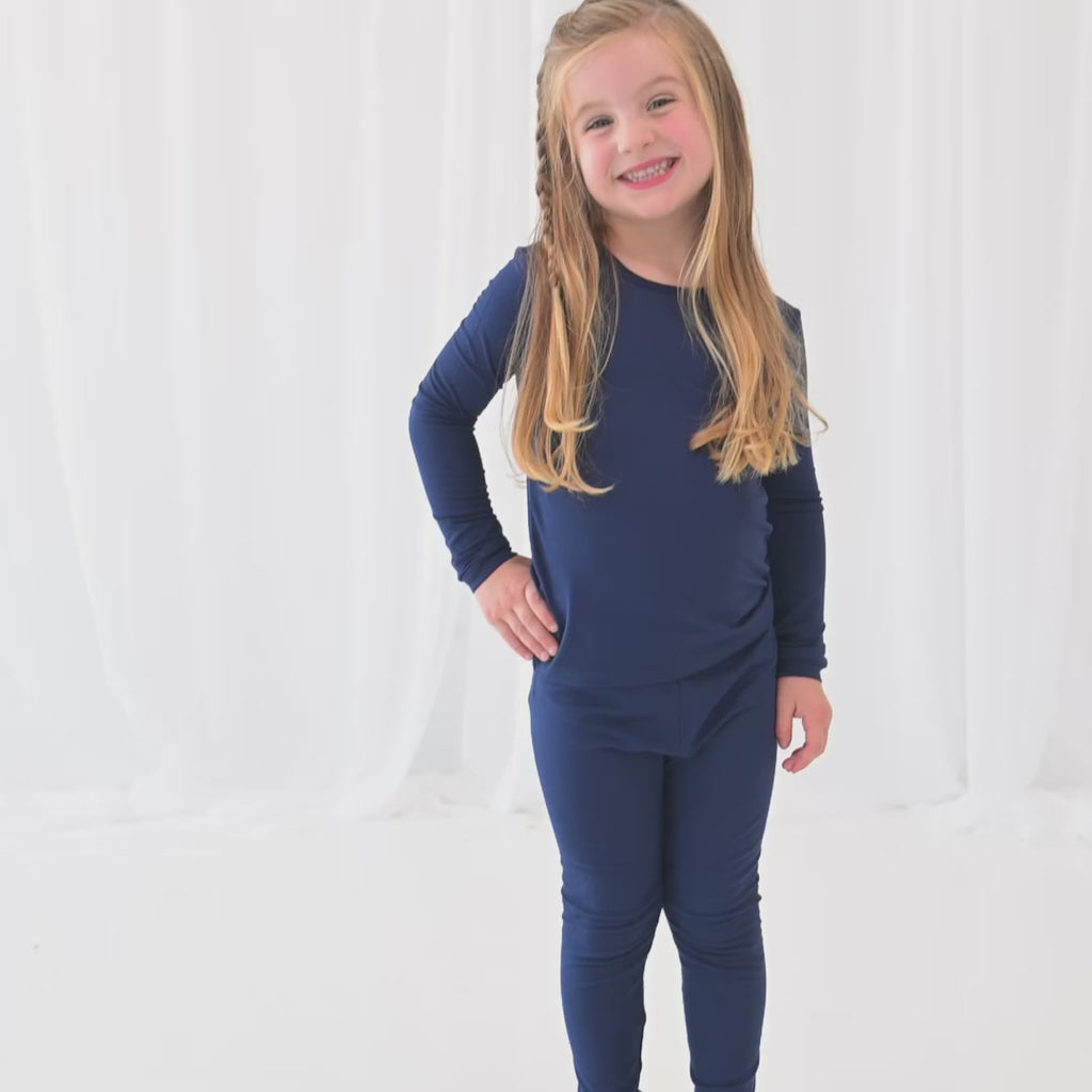Video of Child wearing Long Sleeve Navy Blue Pajamas