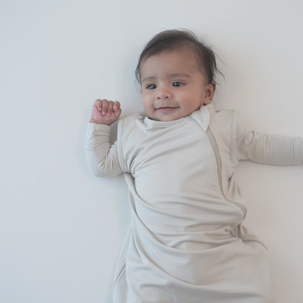 Video of an infant modeling the 0.5 Tog Sleep Bag in Oat