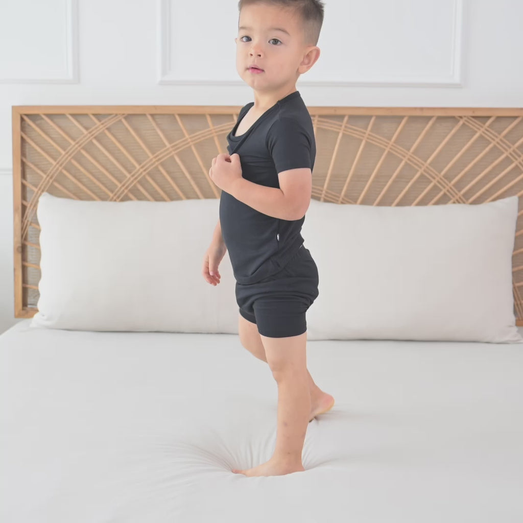 Toddler wearing Black Short Sleeve Pajamas in Midnight