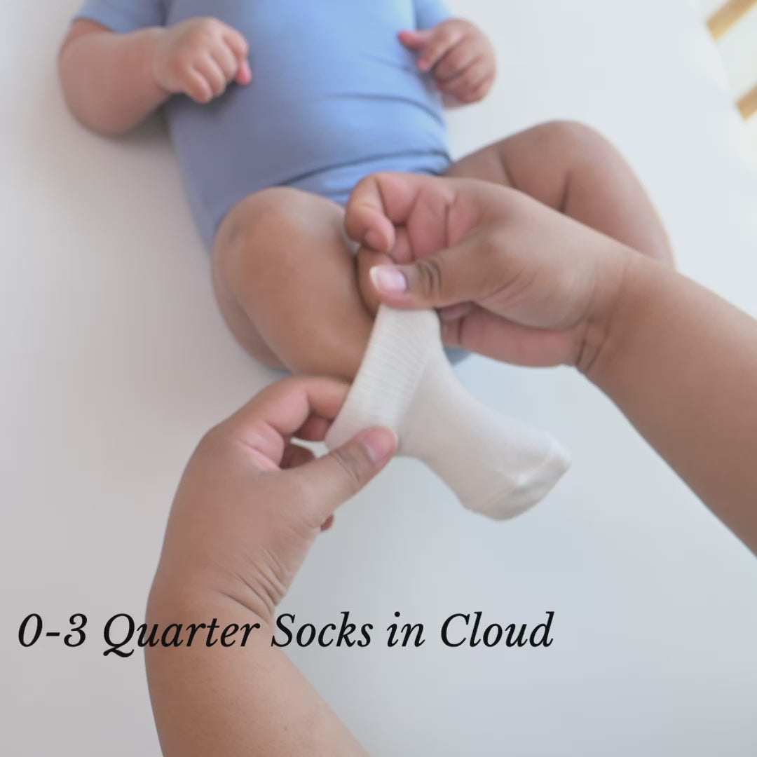 Video of parent putting Kyte Baby Quarter Socks on Newborn