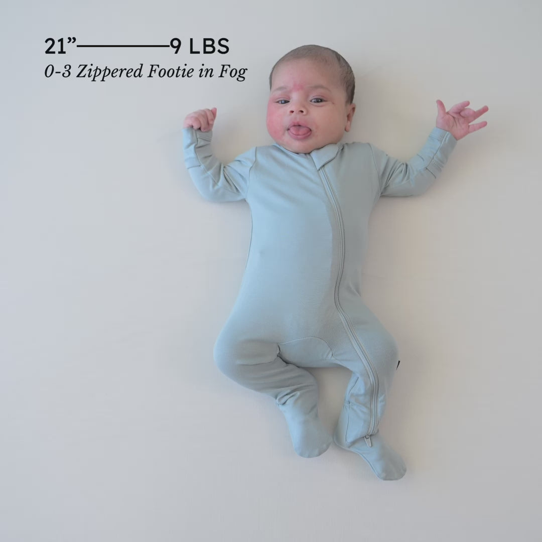 Video of newborn baby wearing the Zippered Footie in Fog