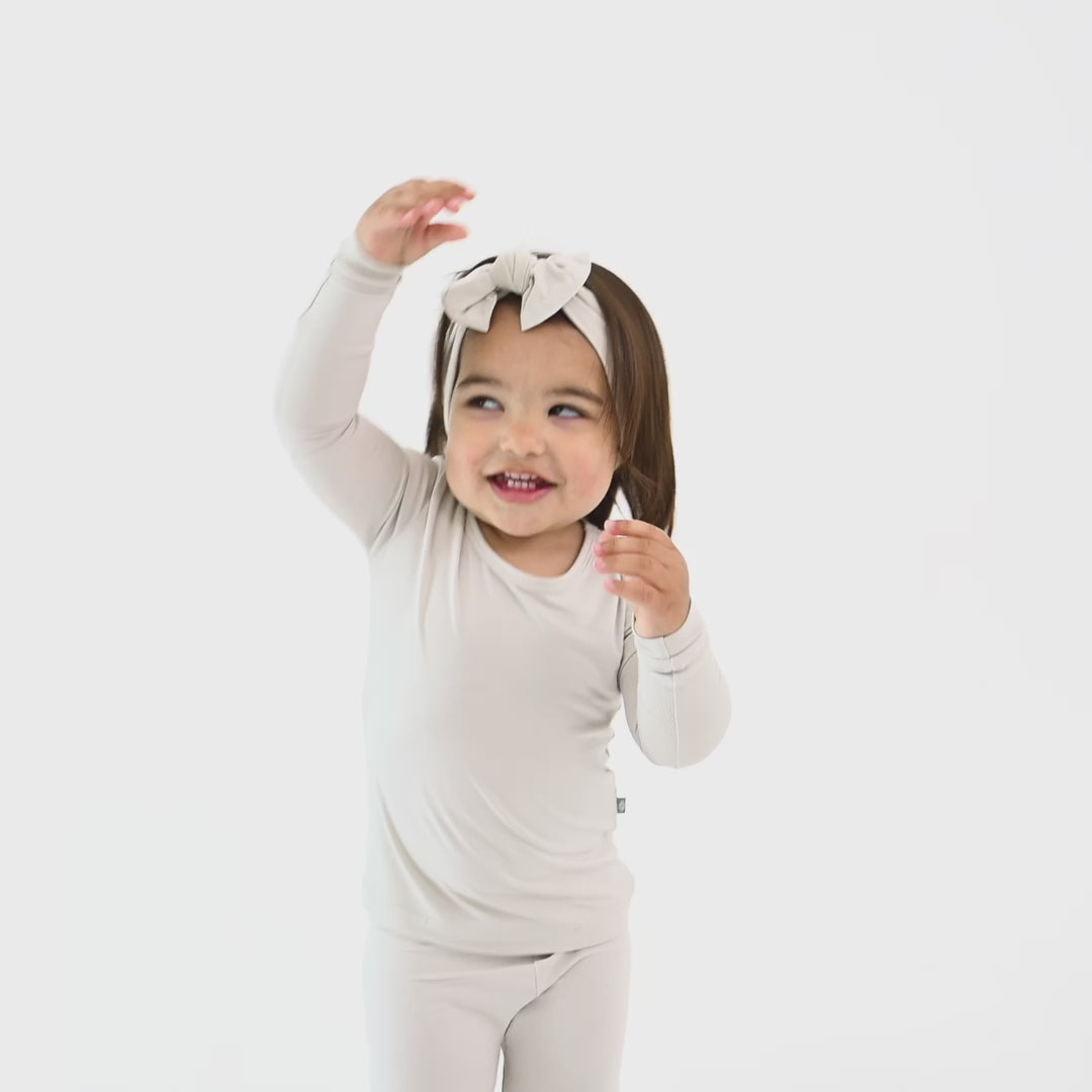 Video of Child wearing Long Sleeve Pajamas in Oat