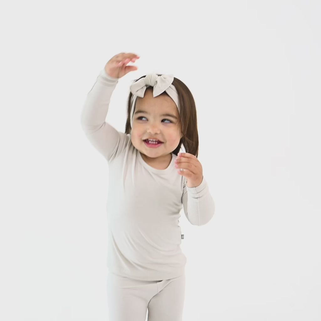 Video of Child wearing Long Sleeve Pajamas in Oat