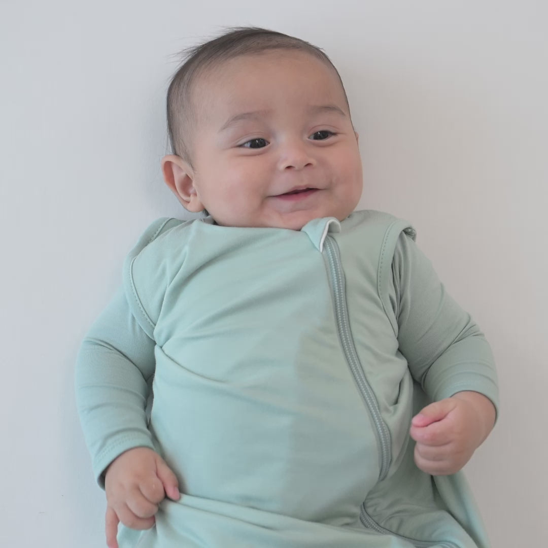 Video of baby modeling the  0.5 Tog Sleep Bag in Sage 