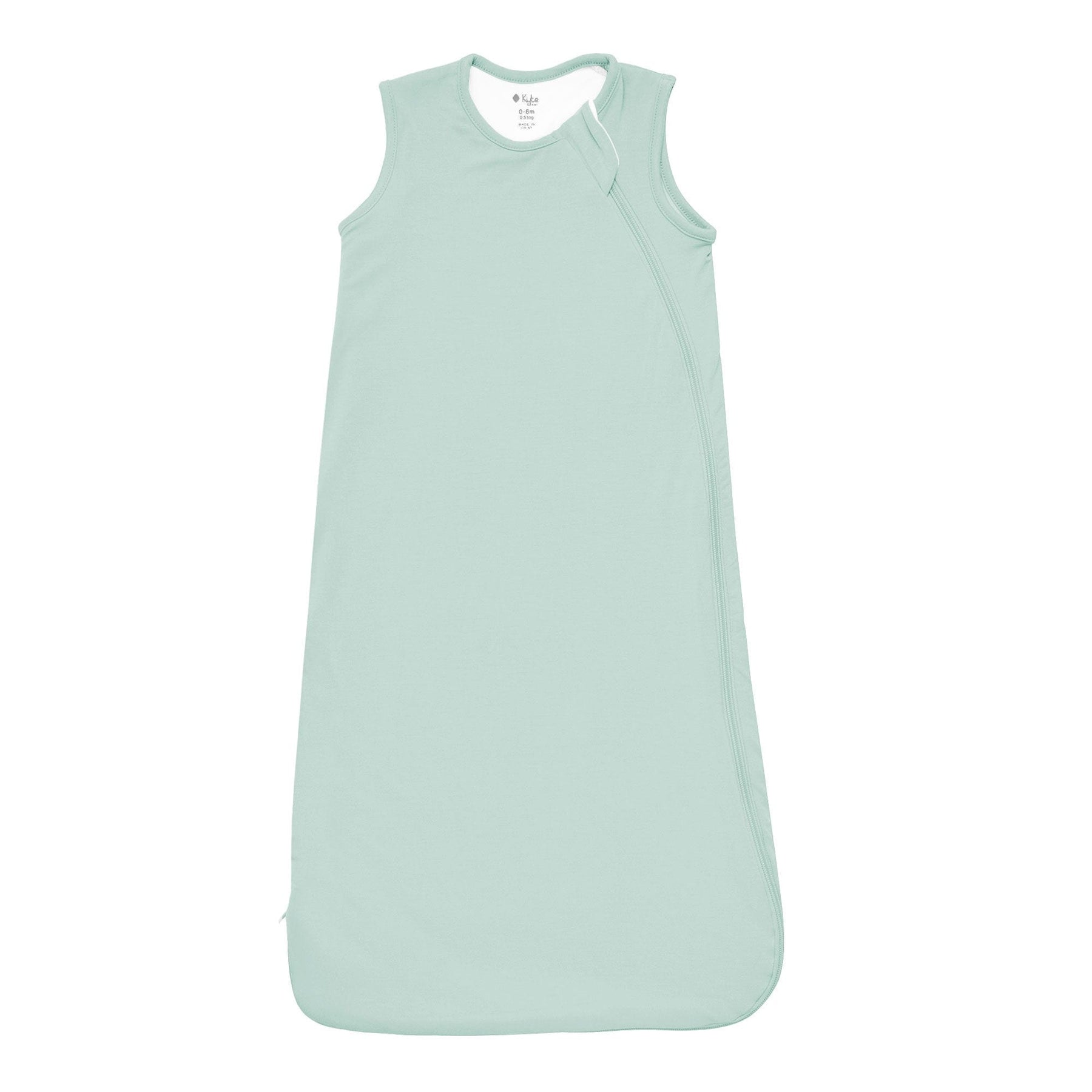 Flat lay photo of the Kyte Baby Sleep Bag in Sage 0.5