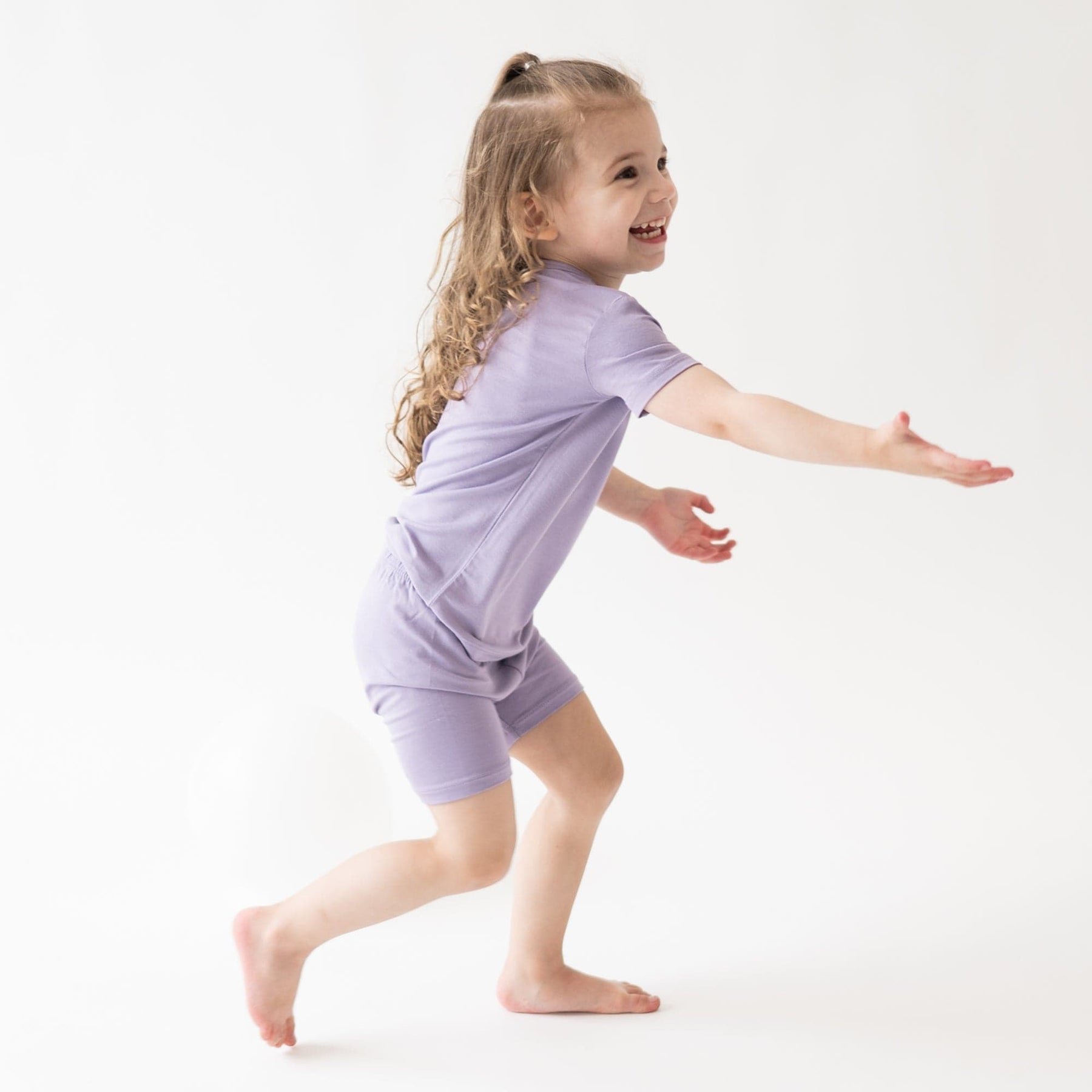 Girl wearing Short Sleeve Toddler Pajamas in Taro 