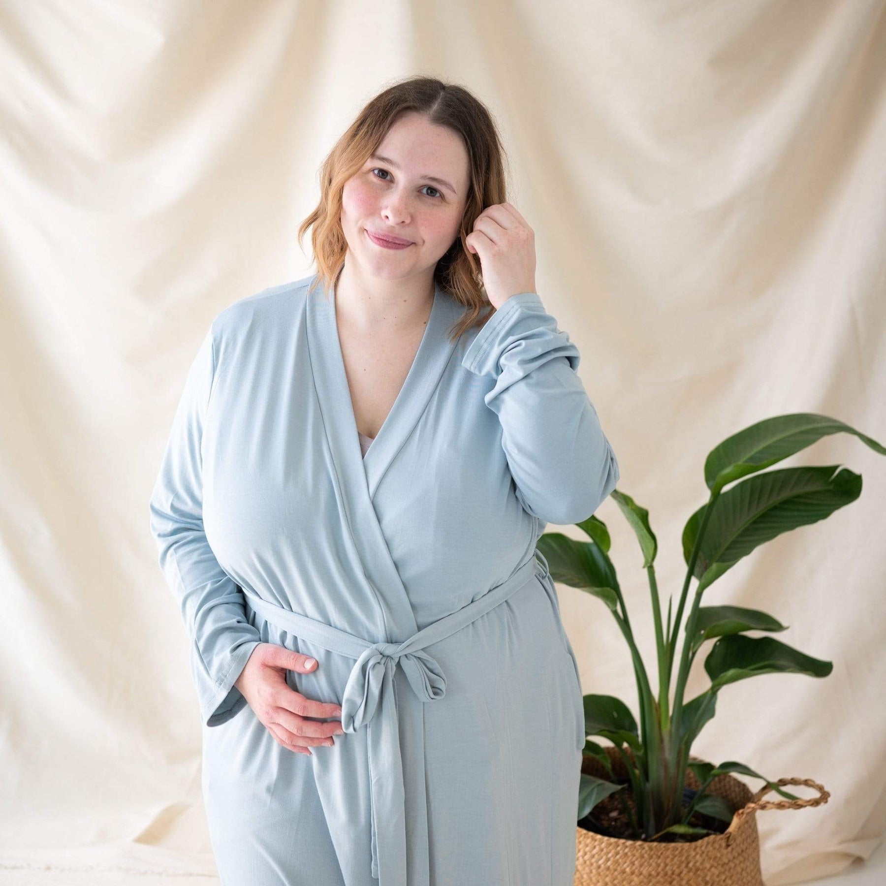 Woman wearing Kyte Baby Women’s Lounge Robe in Fog